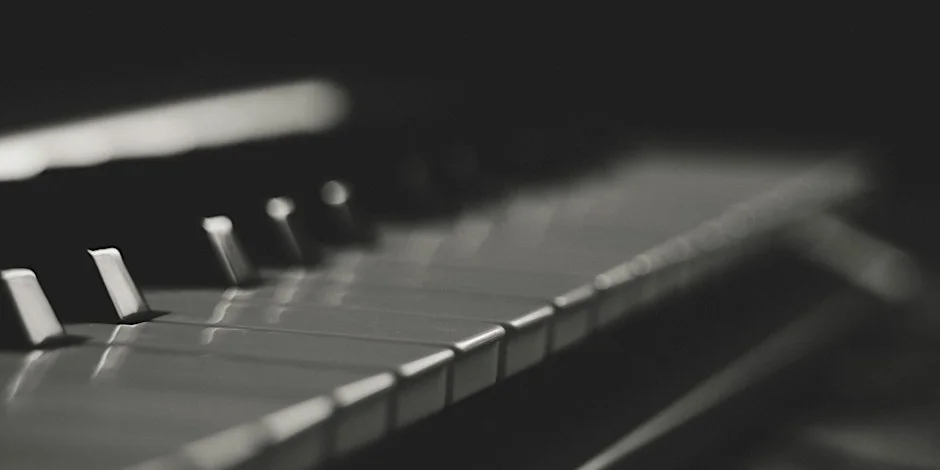 Black and white photo of piano keys